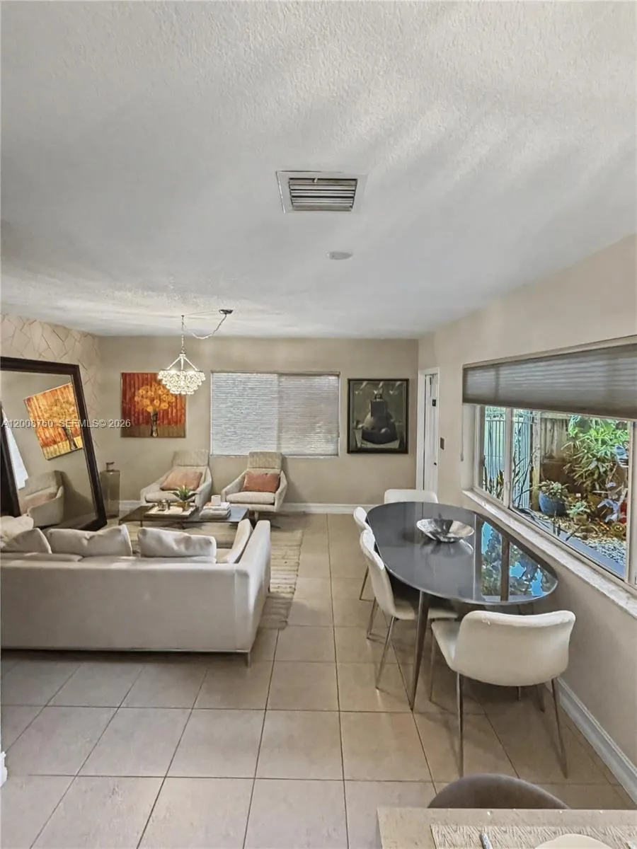 Dual-exposure corner windows flood the living space with natural light