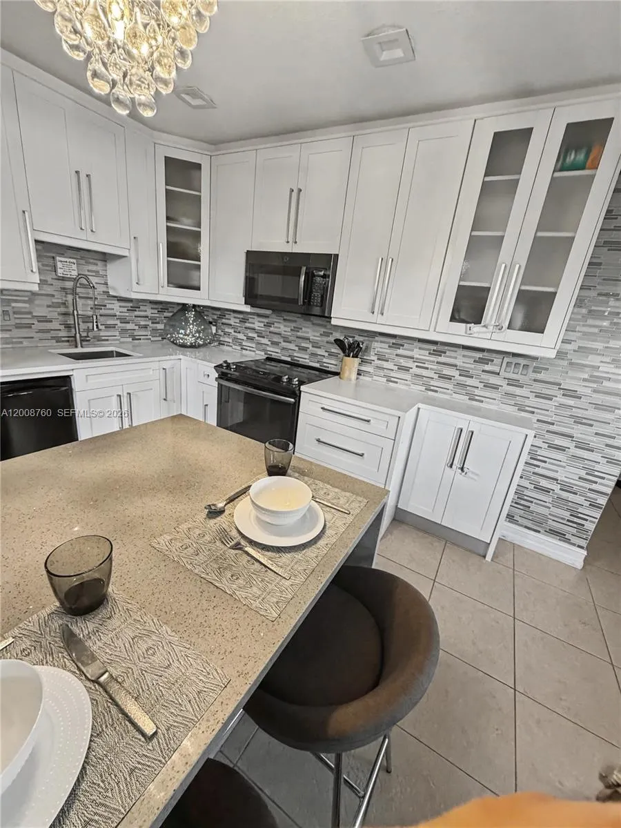 Spacious kitchen with island bar — ideal for entertaining and everyday living