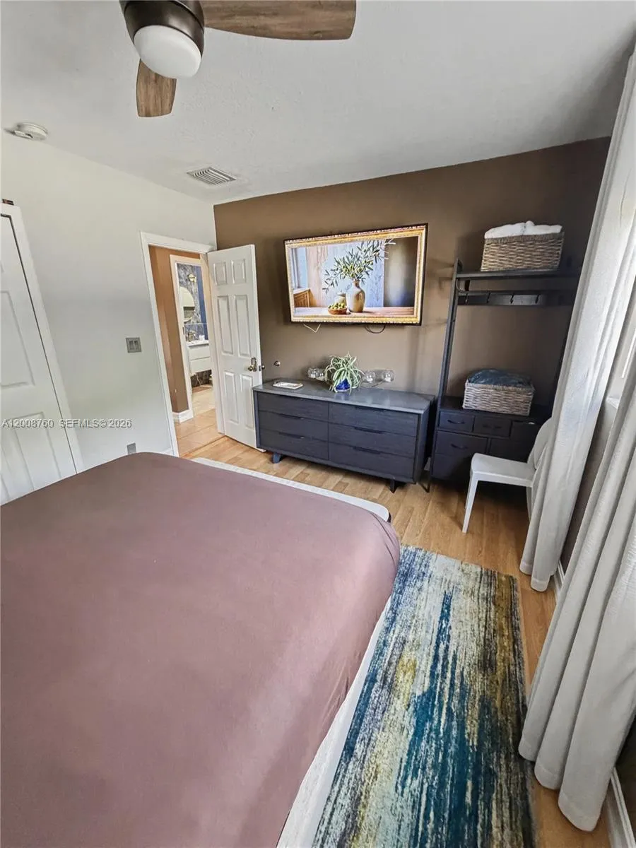 Bright primary bedroom with stylish design throughout