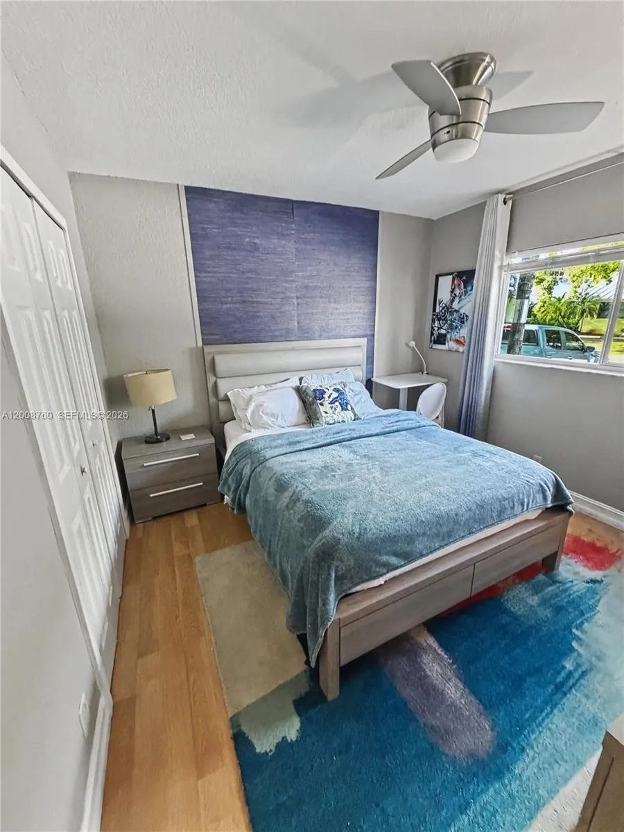 Second bedroom — bright and comfortable with ample closet space