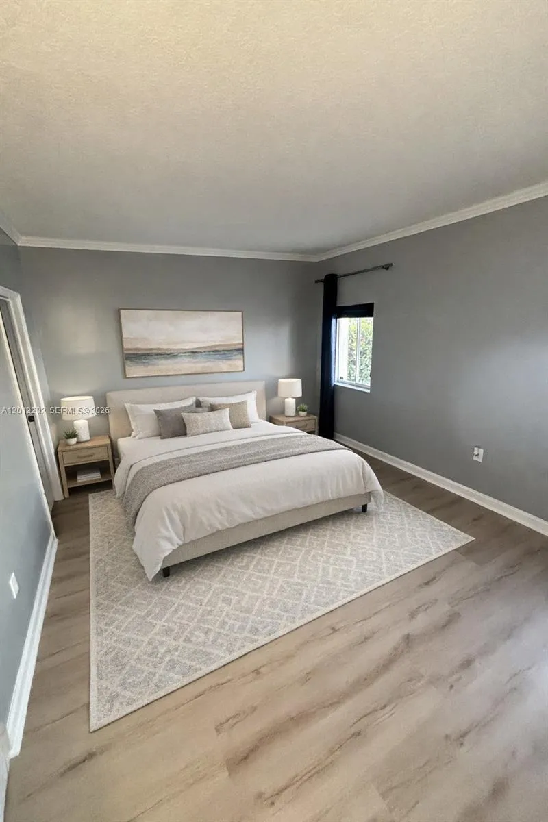 Virtually Staged Master Bedroom with French Doors that lead to the Patio