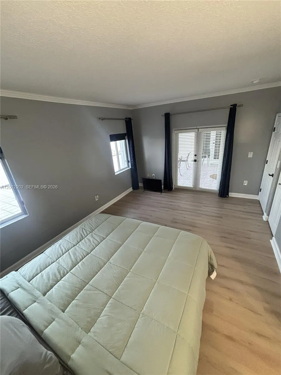 Spacious Master Bedroom Suite with French Doors that lead to the Patio
