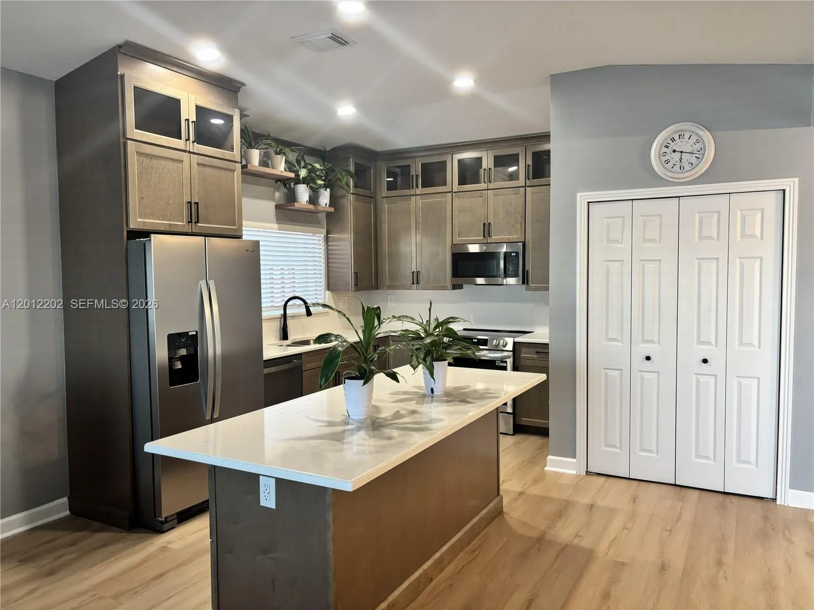 Completely Remodeled Kitchen with Stainless Steel Appliances, Quartz Countertops and New Cabinetry.