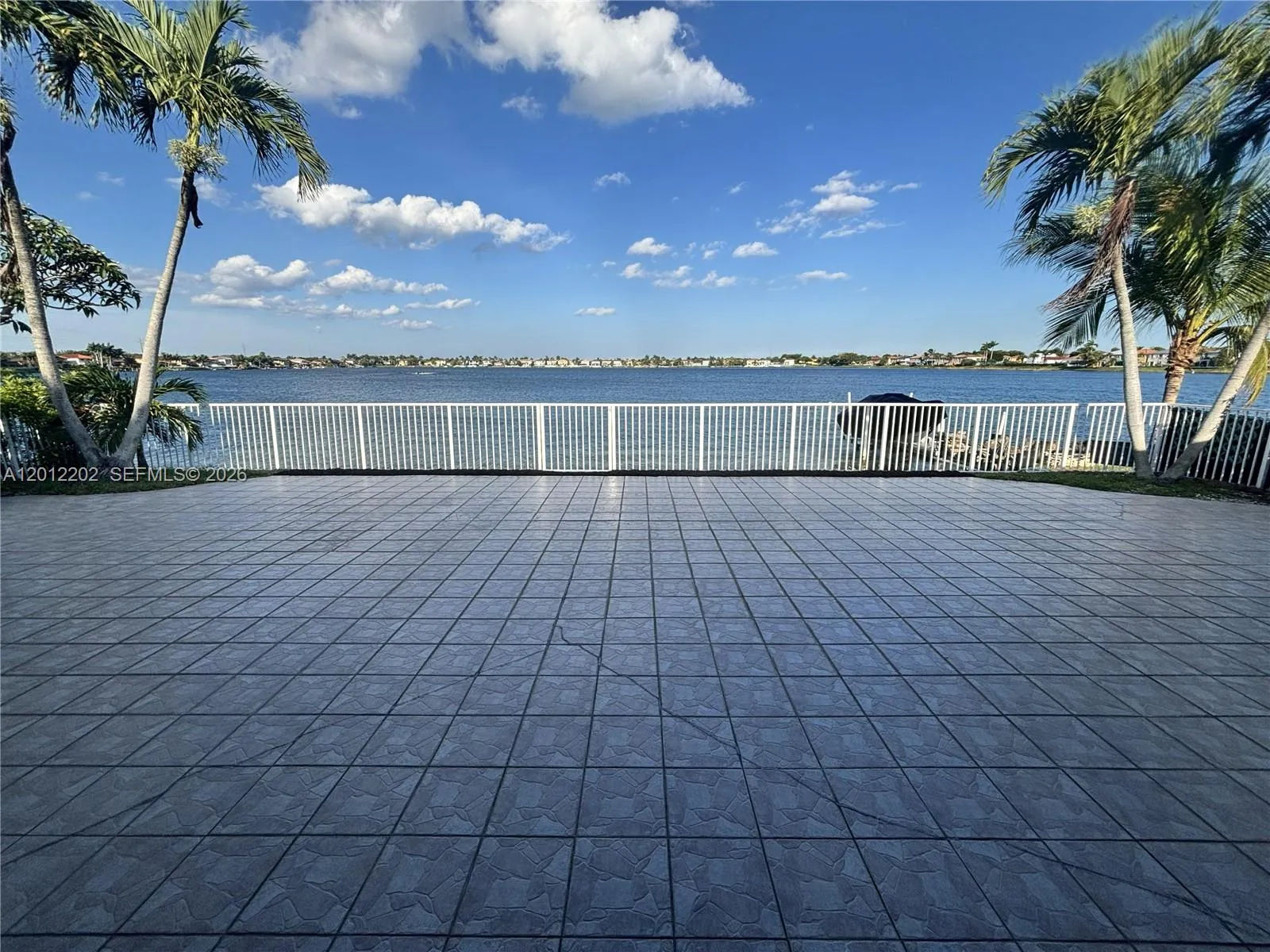 Spacious patio with a paradise view perfect for outdoor entertaining and relaxing.