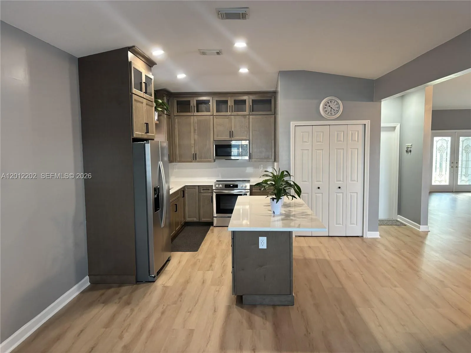 Completely Remodeled Kitchen with Stainless Steel Appliances, Quartz Countertops and New Cabinetry.