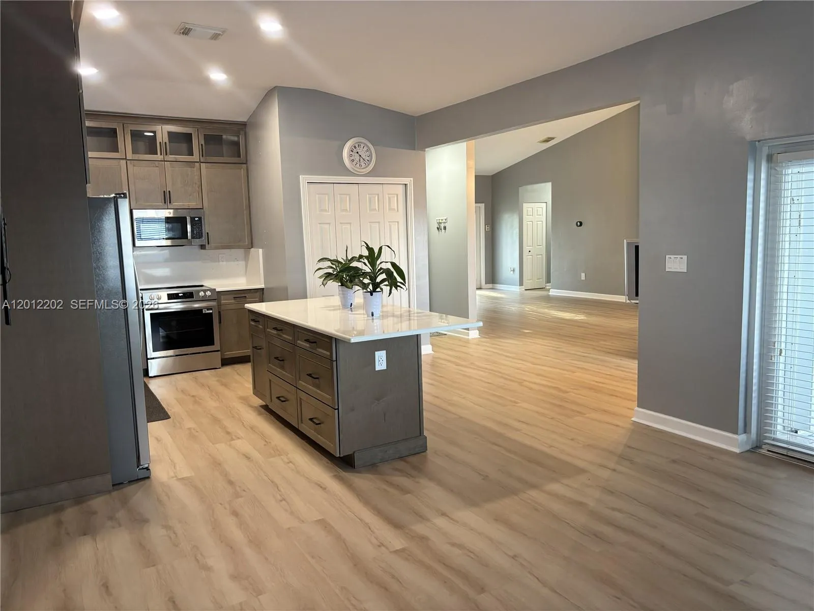 Completely Remodeled Kitchen with Stainless Steel Appliances, Quartz Countertops and New Cabinetry.