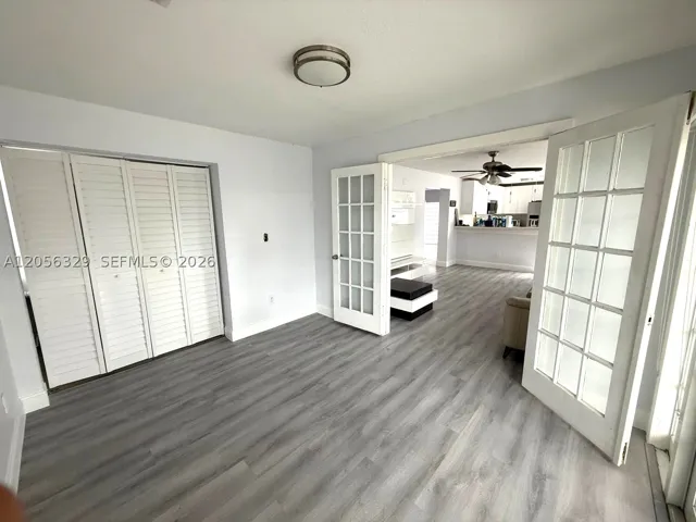 GROUND LEVEL ROOM WITH HALF BATH MAYBE USED AS FOURTH BEDROOM OR OFFICE