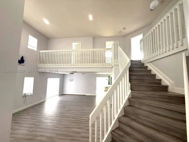 VIEW OF LIVING AND DINING ROOM FROM