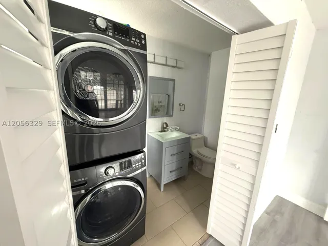 HALF BATH IN GROUND FLOOR AND LAUNDRY.