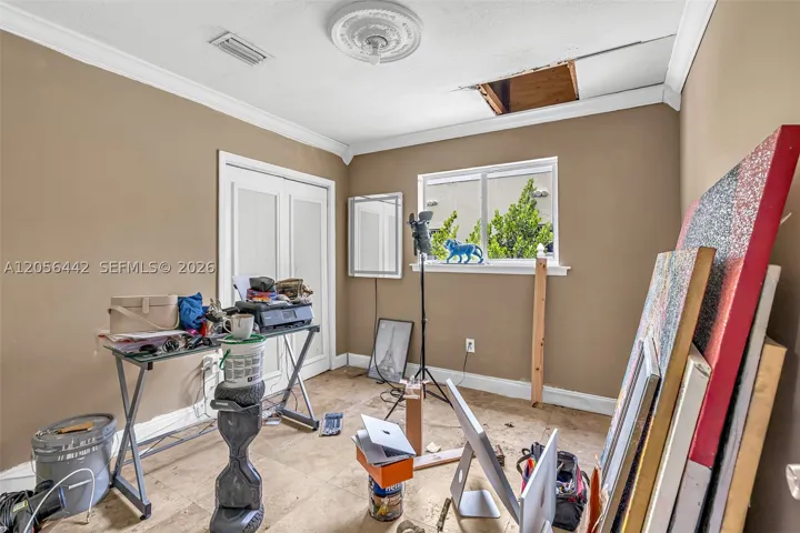 3rd bedroom with drywall damage