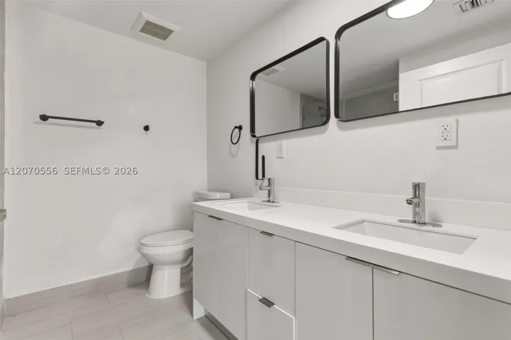 A spacious double vanity gives you extra counter space, storage, and room to make busy mornings feel a little easier.