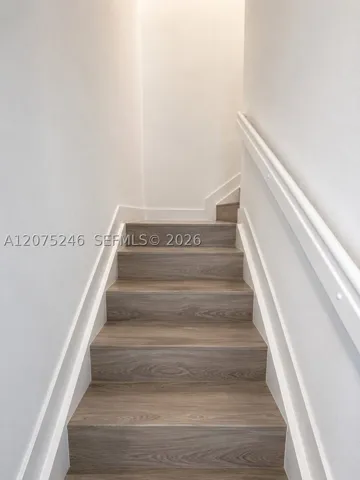 updated staircase with wood-look flooring