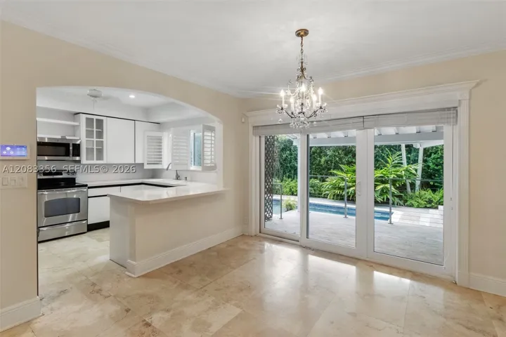 Large Gourmet Open Kitchen with Views to Pool and Patio
