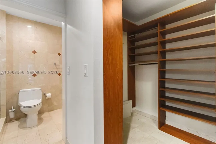 Custom Primary Closet with Direct Access to Primary Bathroom