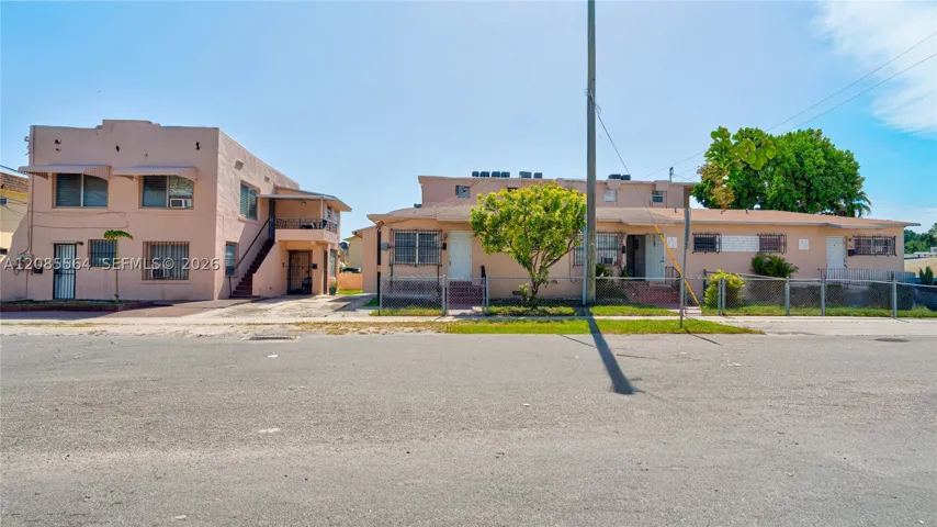 Corner property with 1937 duplex on left and 1954 triplex on the right. Property faces 18 Ave with side to 7th Street. One block from 8 Street.