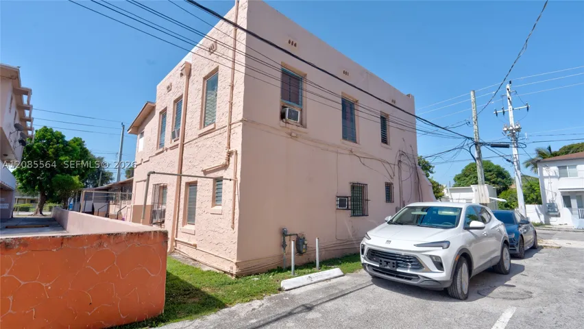 Duplex back view. Parked cars shown are on lot next to it.