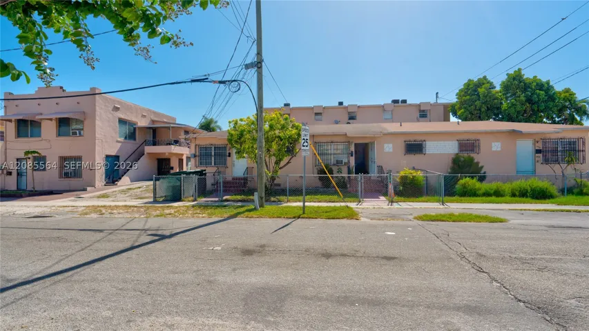 Two story duplex built in 1937 with one story triplex built in 1954.