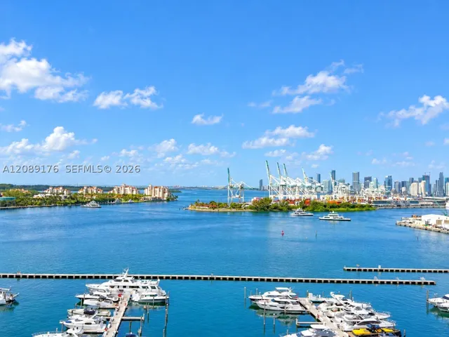 Breathtaking open balcony view of Biscayne Bay, marina, and Miami Beach skyline