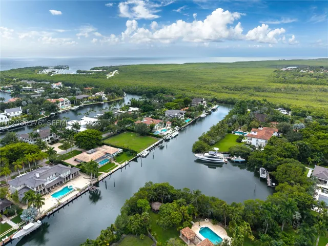 The property can accommodate an approximately 100-foot yacht, while the wide bay beyond provides the maneuvering room a vessel of this scale requires.