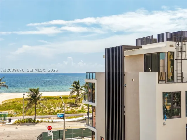 Facade detail, ocean beyond.