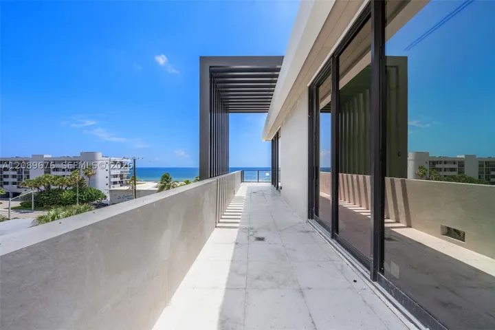 Fourth-floor terrace through the louvered pergola.