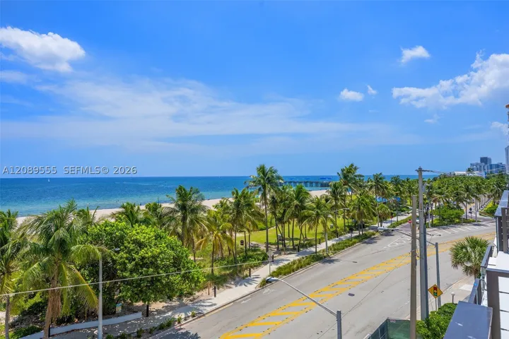 View south along the beach to the Pompano Beach pier.