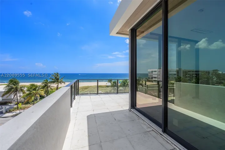 Fourth-floor terrace and glass wall.