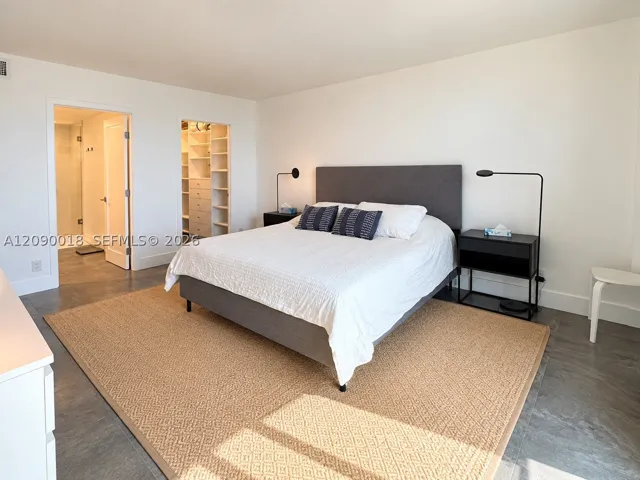 Primary bedroom with direct natural light and tasteful decor.