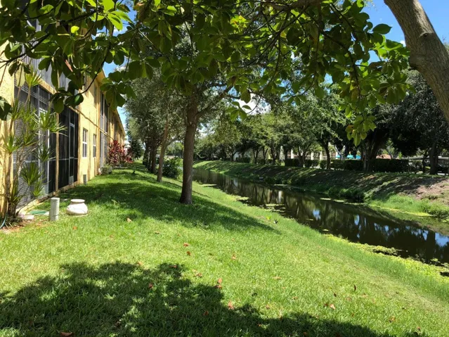 Behind building