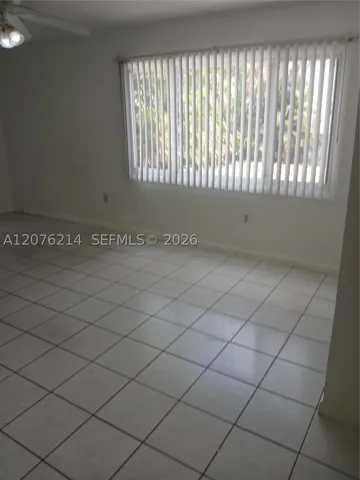 3rd bedroom has a large window w view to the backyard