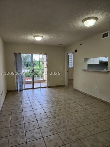 Living Room faces West & very pretty residential Coral Gables neighborhood