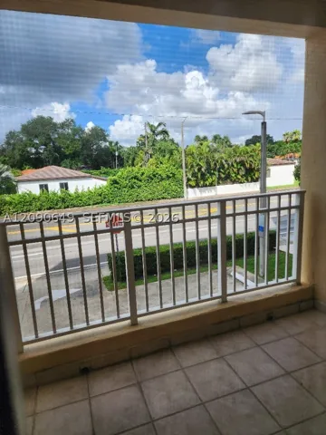 View of Sunset & pretty Coral Gables residential neighborhood