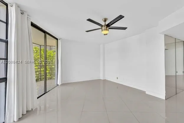 LIVING ROOM - ENTRANCE TO BALCONY
