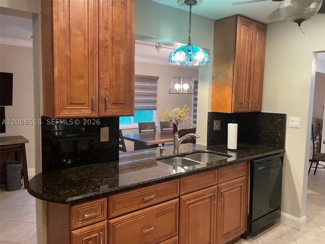 WITH  PASSTHRU TO FAMILY ROOM OR DINING ROOM