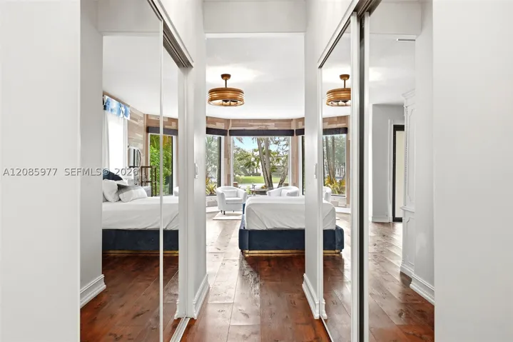 View from primary bathroom into primary bedroom