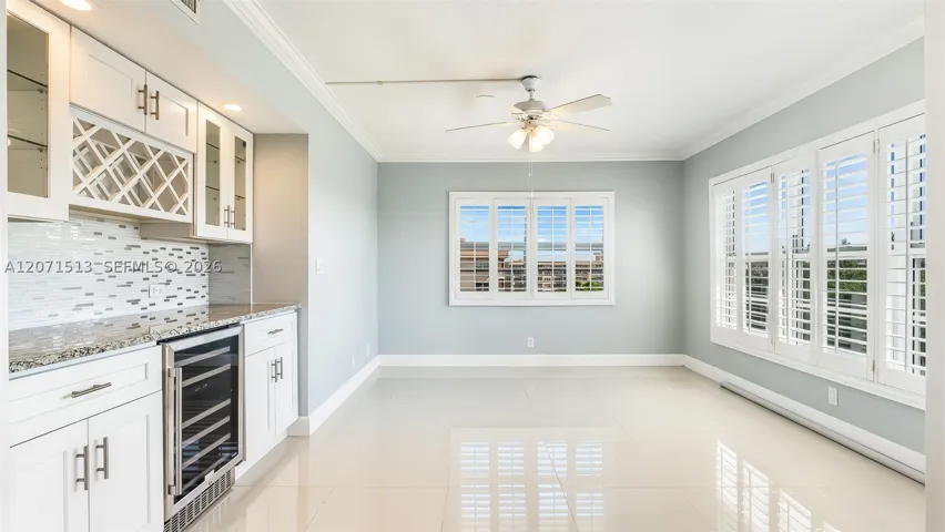 Spacious room used as Den with Bar area perfect for entertaining.