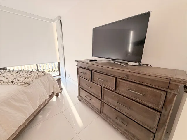 Bedroom #2 with plenty of storage and TV.