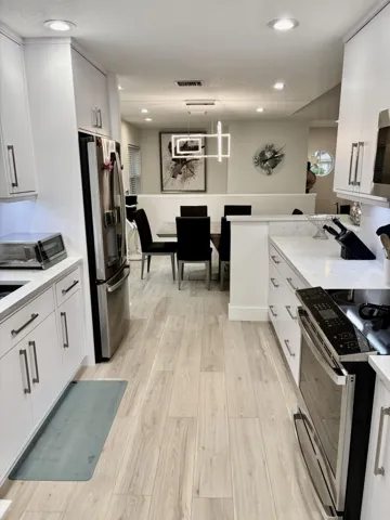 KITCHEN LOOKING INTO DINING ROOM