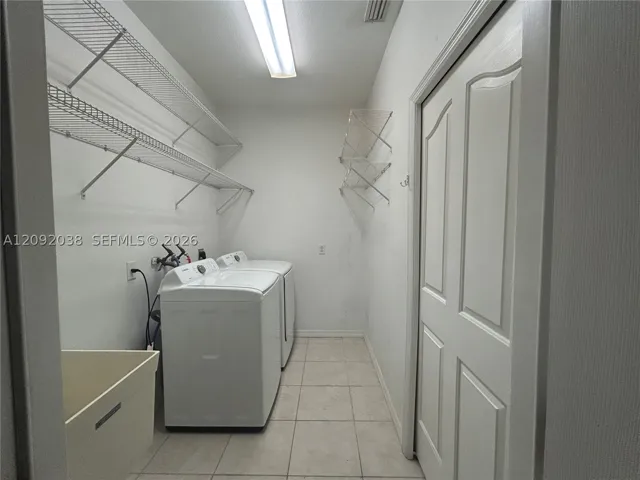 Laundry room with plenty of storage space!