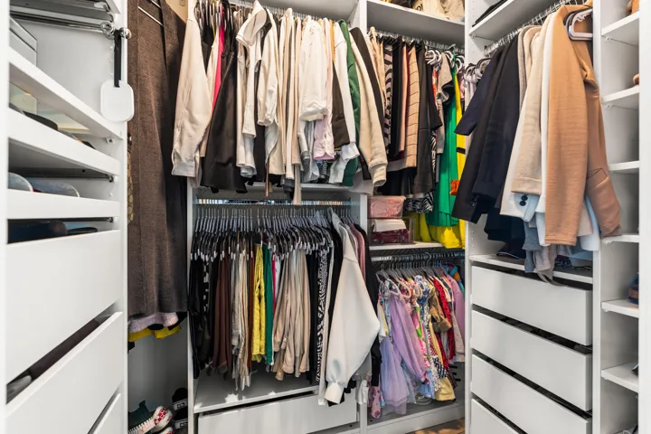 Walk In Closet with Custom Cabinetry