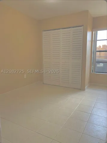 1 of 2: Photographs depicting the second bedroom.