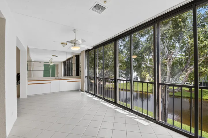 Glass enclosed patio overlooking lake