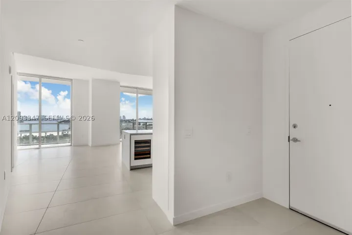 Entry hall opening directly into the living area with Biscayne Bay views