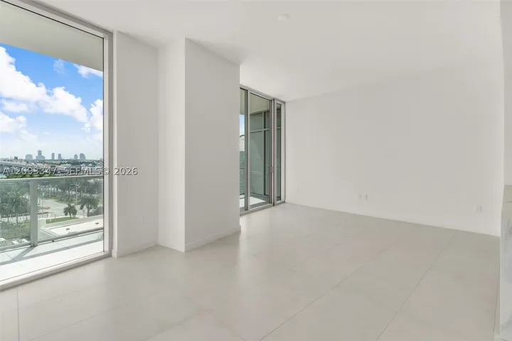 Living area measuring 22 by 18 feet with continuous glass to the terrace