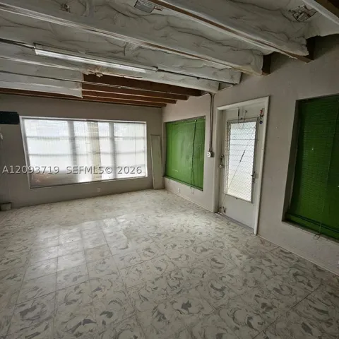 per owner- floor is Cuban tile.  Opens to back yard area