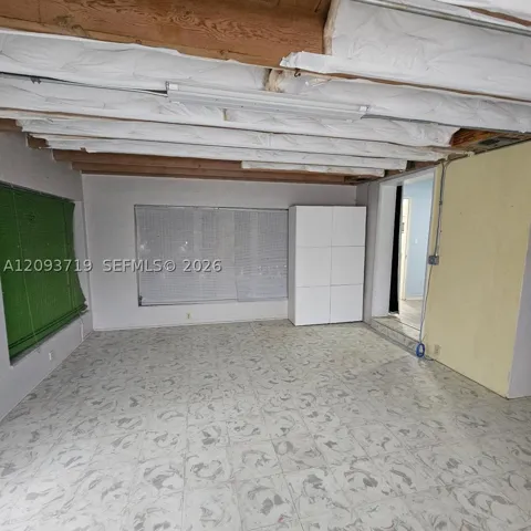 Florida room has wood beam ceilings- currently covered with insulation