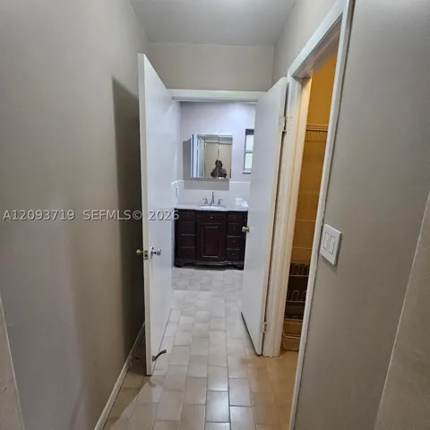 hallway to primary bath