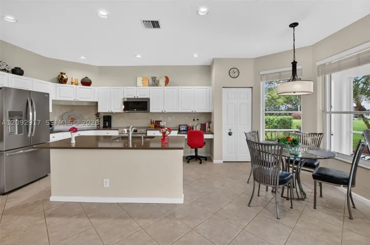 Updated kitchen with stainless appliances and quartz countertops.