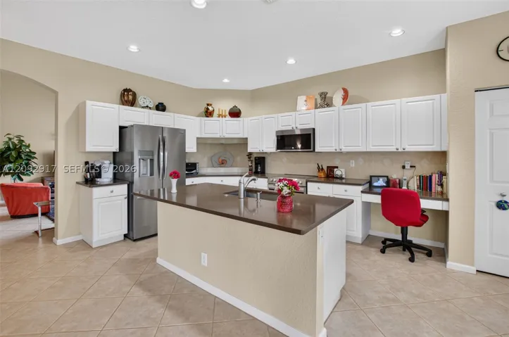 Updated kitchen with stainless appliances and quartz countertops.