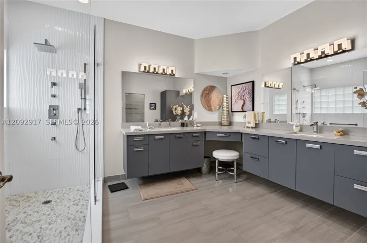Beautifully updated spa-like bathroom with jetted shower.